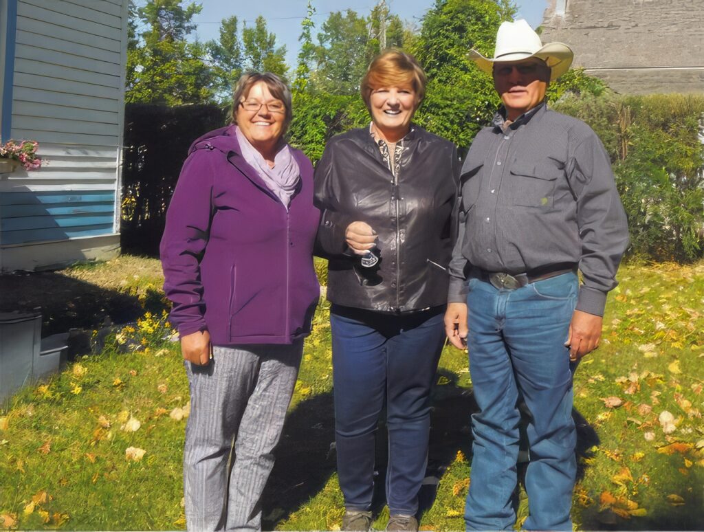 Outside the Buttermaker House, from left to right, is d'Arcy Gamble, president of the Stephan G. Stephansson Icelandic Society, Judy Winn, seller of the house, and Richard Lorenz, Red Deer County councillor.